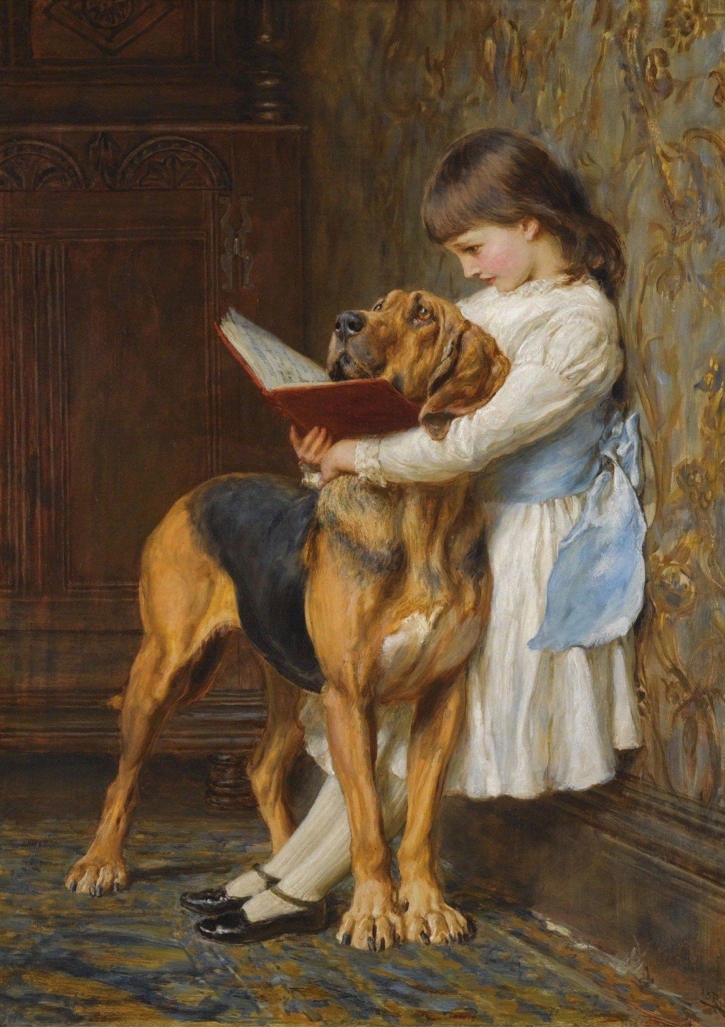 Bimba che legge un libro col suo cane